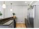 Modern kitchen with stainless appliances, gray cabinetry, granite counters, and industrial-style lighting at 820 Dekalb Ne Ave # 2, Atlanta, GA 30307