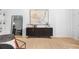 Minimalist living room with modern furniture, decorative mirror, and neutral-toned abstract art at 820 Dekalb Ne Ave # 2, Atlanta, GA 30307