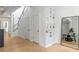 Inviting living room with hardwood floors, staircase, shelving, and mirror accent at 820 Dekalb Ne Ave # 2, Atlanta, GA 30307