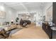 Bright, open-concept living room featuring hardwood floors, modern decor, and seamless flow to the kitchen and dining area at 820 Dekalb Ne Ave # 2, Atlanta, GA 30307