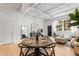 Open-concept living and dining area with ample light, modern decor, and wood flooring at 820 Dekalb Ne Ave # 2, Atlanta, GA 30307