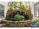Beautiful outdoor water feature with rock accents and mature plant life at 820 Dekalb Ne Ave # 2, Atlanta, GA 30307