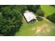 Aerial view of a building with an open side, sitting on green fields near trees at , Social Circle, GA 30025