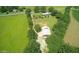 Aerial view of large metal building among green fields and foliage at , Social Circle, GA 30025