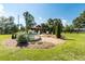 This backyard features an above-ground stock tank pool, landscaping, and a wooden deck with chairs at , Social Circle, GA 30025
