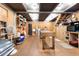 Spacious basement with exposed ceiling, ample storage, and a large work table at , Social Circle, GA 30025