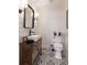 Chic bathroom with modern sink and fixtures, stylish mirror, and unique patterned tile flooring at , Social Circle, GA 30025