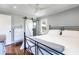 This bedroom has hardwood floors, a modern black metal bed frame, and a white barn door at , Social Circle, GA 30025