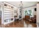 Versatile bonus room with built-in bookshelves, natural light, and desk space for a home office or study area at , Social Circle, GA 30025