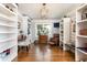 Versatile bonus room with built-in bookshelves, natural light, and ample space for a home office or entertainment area at , Social Circle, GA 30025