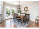 Charming dining area with hardwood floors, modern light fixture, and access to the outdoor patio at , Social Circle, GA 30025