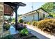 Landscaped exterior with lush greenery, a stone walkway, and a covered entrance at , Social Circle, GA 30025