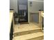 Close-up of front porch with wood stairs, black railings, and a 'Welcome' mat at , Social Circle, GA 30025