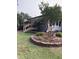 Quaint home exterior with landscaped front yard, stone retaining wall, and inviting entry at , Social Circle, GA 30025