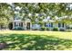 Charming single-story home with a welcoming entryway framed by lush green foliage and a manicured lawn at , Social Circle, GA 30025