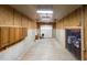 Spacious garage with built-in cabinets and a large overhead door for easy access at , Social Circle, GA 30025