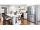 Modern kitchen with white cabinets, stainless steel appliances, and a stylish island offers a functional space at , Social Circle, GA 30025