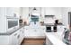 Bright kitchen with white cabinetry, stainless appliances, and modern fixtures offers a fresh, clean design at , Social Circle, GA 30025