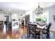 Well-lit kitchen featuring stainless steel appliances, a center island with seating, and an adjacent dining area at , Social Circle, GA 30025