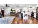 Open-concept living space with hardwood floors connecting a modern kitchen and a cozy living area at , Social Circle, GA 30025