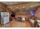Cozy living room featuring rustic wood paneling and a vintage-style refrigerator at , Social Circle, GA 30025