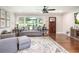 Comfortable living room with hardwood floors, large windows, and modern decor provides a relaxing atmosphere at , Social Circle, GA 30025