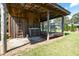 Rustic outdoor kitchen with sink, covered patio, and rocking chairs overlooking the yard at , Social Circle, GA 30025