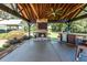Outdoor kitchen featuring brick fireplace, tv, bar and grill at , Social Circle, GA 30025