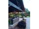 Cozy outdoor patio area with comfortable seating, a stone fire pit, and string lights for evening enjoyment at , Social Circle, GA 30025