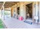 Charming porch with vintage Coca-Cola decor, rocking chairs, and a welcome mat at , Social Circle, GA 30025