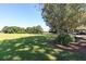 Expansive green lawn area with mature trees and convenient covered parking at , Social Circle, GA 30025