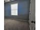 Neutral bedroom with carpet, a window with blinds, and white trim at 1194 Clichy Ct, Marietta, GA 30066