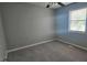 Clean bedroom with carpeted floors, a ceiling fan and natural light from the window at 1194 Clichy Ct, Marietta, GA 30066