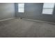 Neutral bedroom with carpeted floors and lots of natural light from windows at 1194 Clichy Ct, Marietta, GA 30066