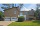 Charming two-story home featuring a two-car garage and a welcoming front porch at 1194 Clichy Ct, Marietta, GA 30066