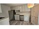 Well-lit kitchen featuring stainless steel appliances and ample cabinet space at 1194 Clichy Ct, Marietta, GA 30066