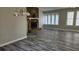 Bright living room featuring a stone fireplace, large windows, and hardwood floors at 1194 Clichy Ct, Marietta, GA 30066