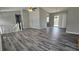 Open-concept living room with hardwood floors and sliding door access to the outside at 1194 Clichy Ct, Marietta, GA 30066