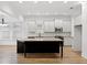 Bright, spacious kitchen with a large island, stainless steel appliances, and white cabinetry offers lots of storage at 232 Hunt Ne St, Marietta, GA 30060