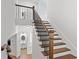 Elegant staircase featuring wood treads, white risers, and a decorative wrought iron railing at 232 Hunt Ne St, Marietta, GA 30060