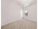 Cozy bedroom featuring neutral carpet and a window with views of the surrounding trees at 2736 Parkway Trl, Lithonia, GA 30058