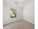 Carpeted bedroom with a window providing natural light and a serene ambiance at 2736 Parkway Trl, Lithonia, GA 30058