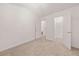 Bedroom featuring a neutral carpet with an ensuite bathroom and walk-in closet at 2736 Parkway Trl, Lithonia, GA 30058