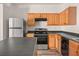 Efficient kitchen featuring stainless steel appliances, wood cabinets, and durable countertops at 2736 Parkway Trl, Lithonia, GA 30058