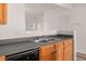 Functional kitchen with wood cabinets and black appliances at 2736 Parkway Trl, Lithonia, GA 30058