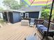 Backyard deck with seating and colorful umbrella, exterior at 3226 Hope St, Hapeville, GA 30354