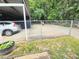 Backyard with carport, driveway, fence and a car parked at 3226 Hope St, Hapeville, GA 30354