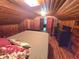 Cozy attic bedroom with natural light, wood paneled walls, and hardwood floors at 3226 Hope St, Hapeville, GA 30354