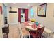 Bright dining area featuring a dining table, tile floor, and convenient access to laundry at 3226 Hope St, Hapeville, GA 30354