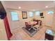 Cozy dining area with a round table, tile floors, and natural light from two windows at 3226 Hope St, Hapeville, GA 30354